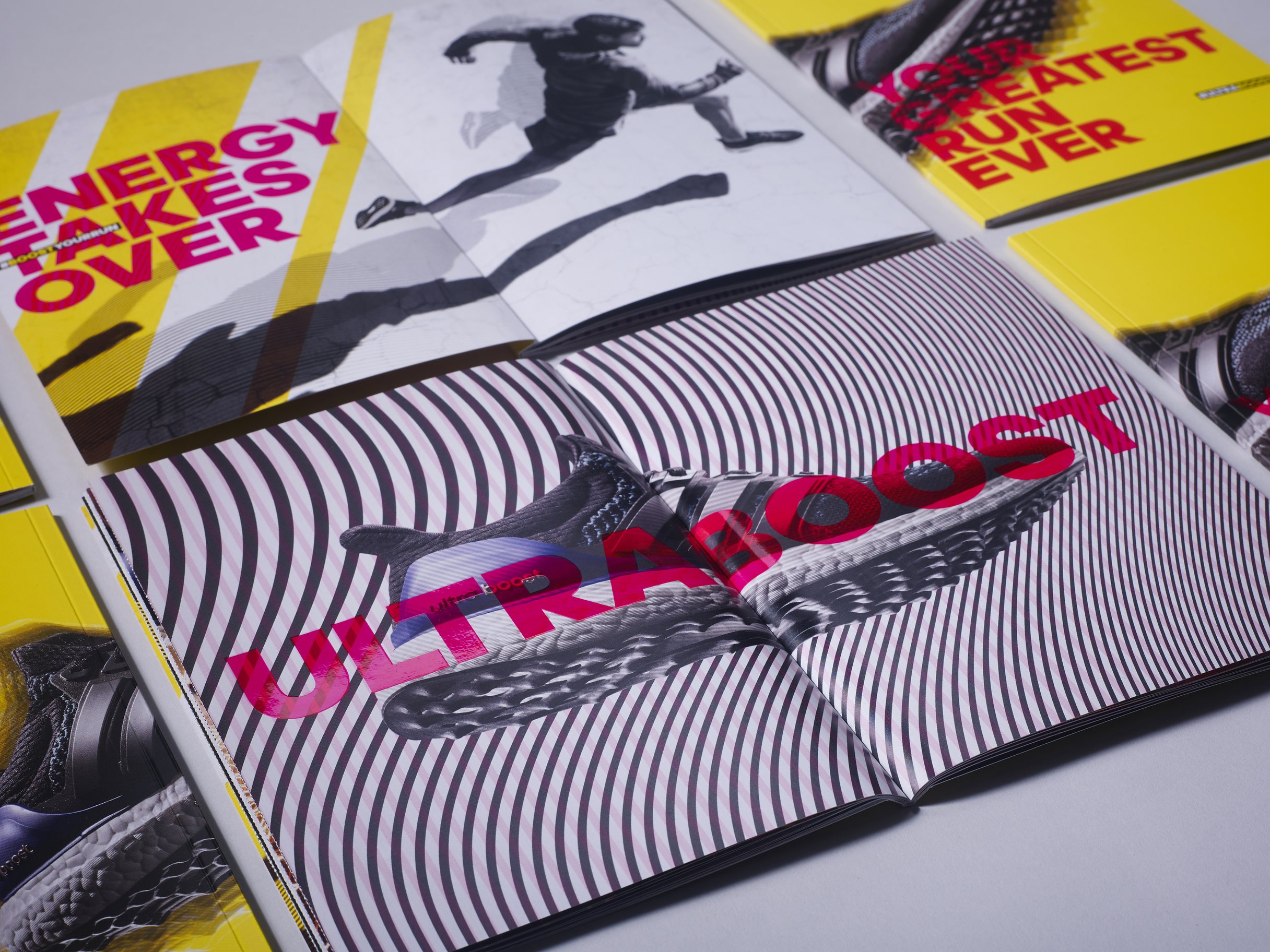 adidas Ultraboost Bible: Energy Takes Over spread above the shoe on black and white lines