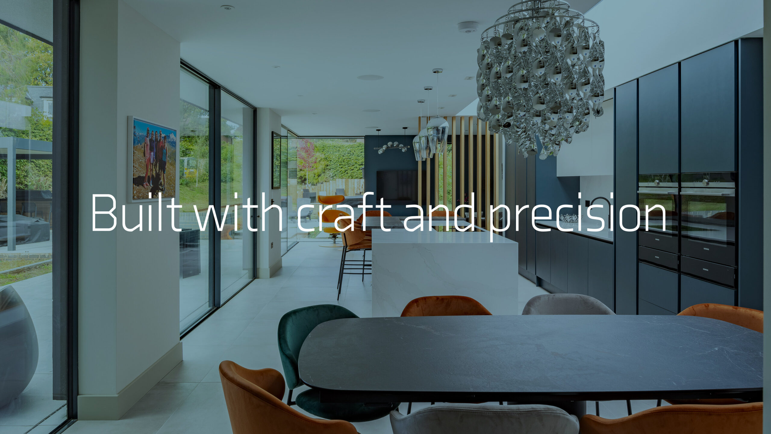 Built with craft and precision, over a kitchen with full-height glazing