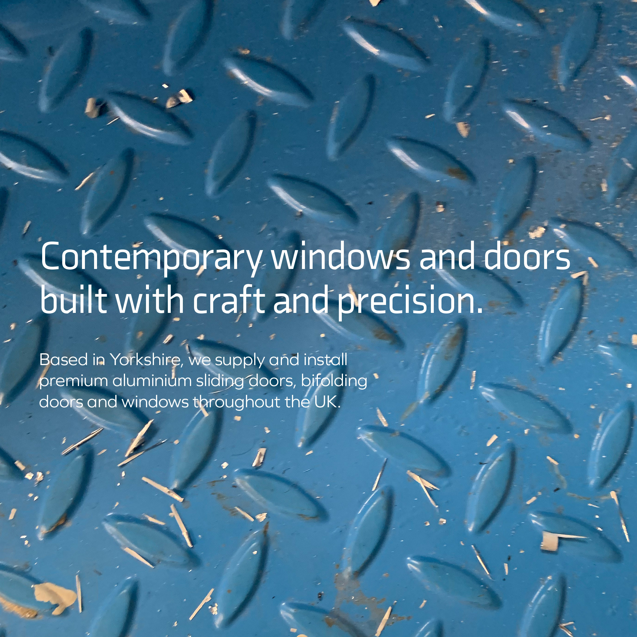 Contemporary windows and doors built with craft and precision, on blue chequer plate
