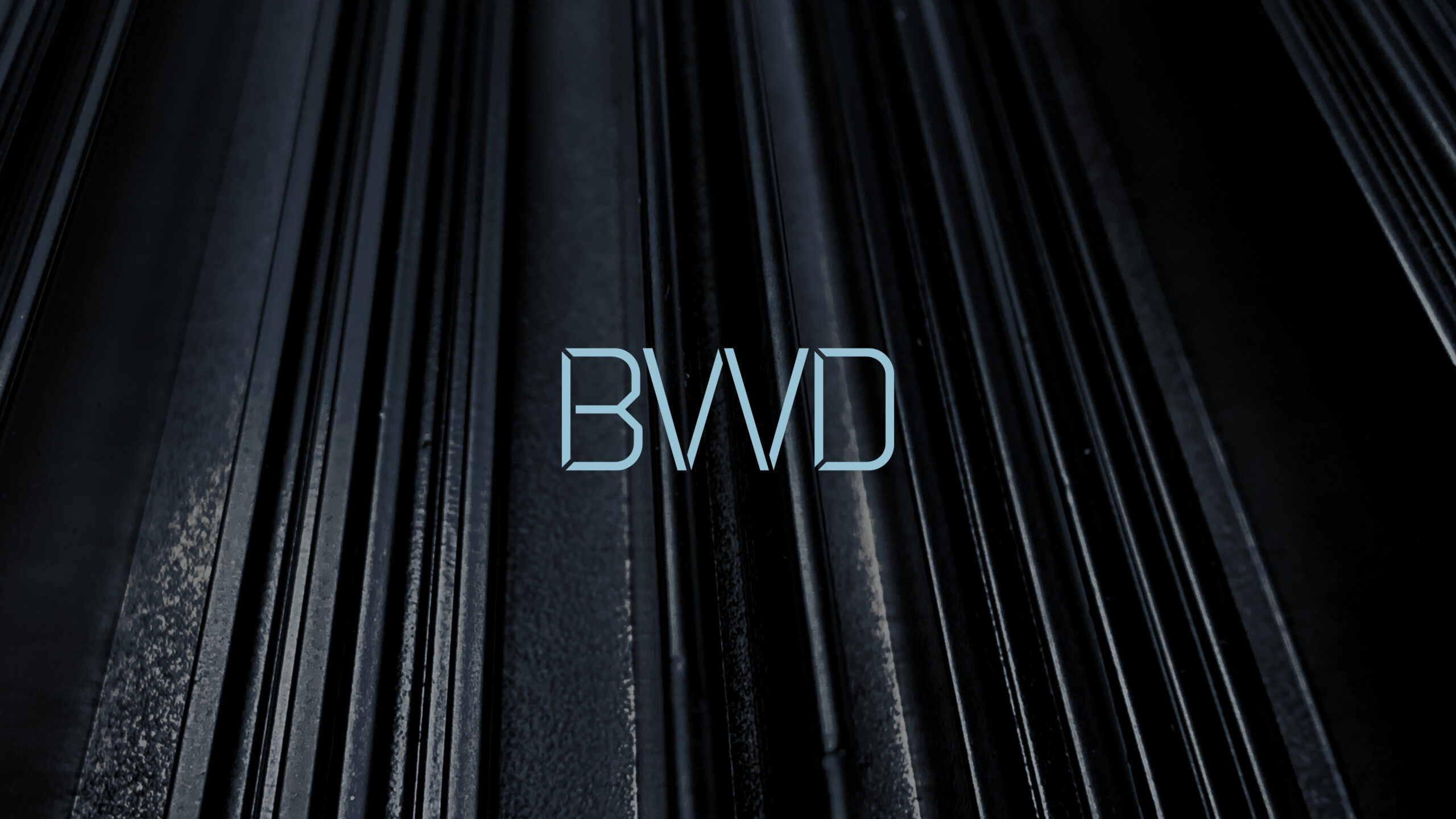 The BWD monogram over a stack of aluminium profiles