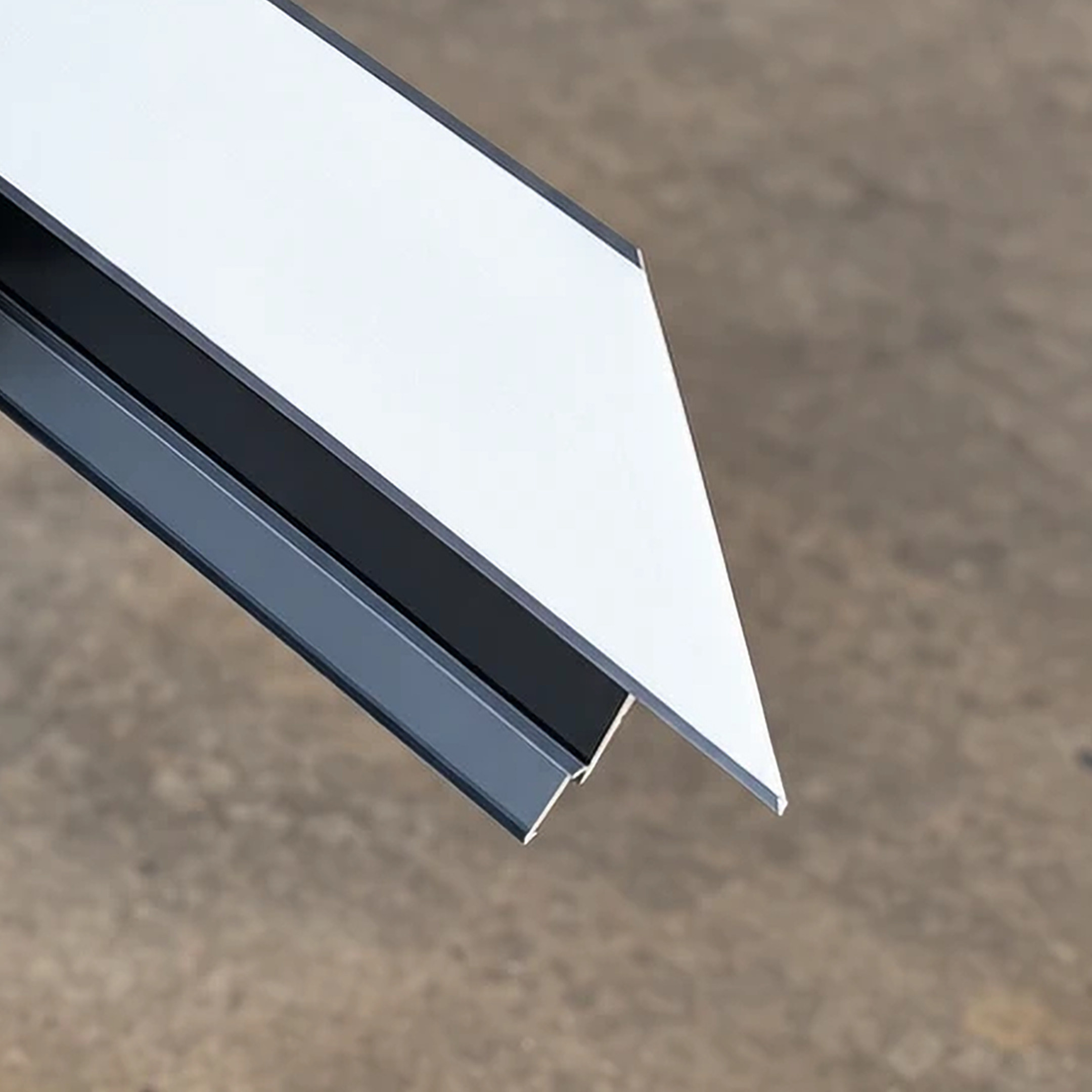 Anthracite aluminium profiles on a workshop floor