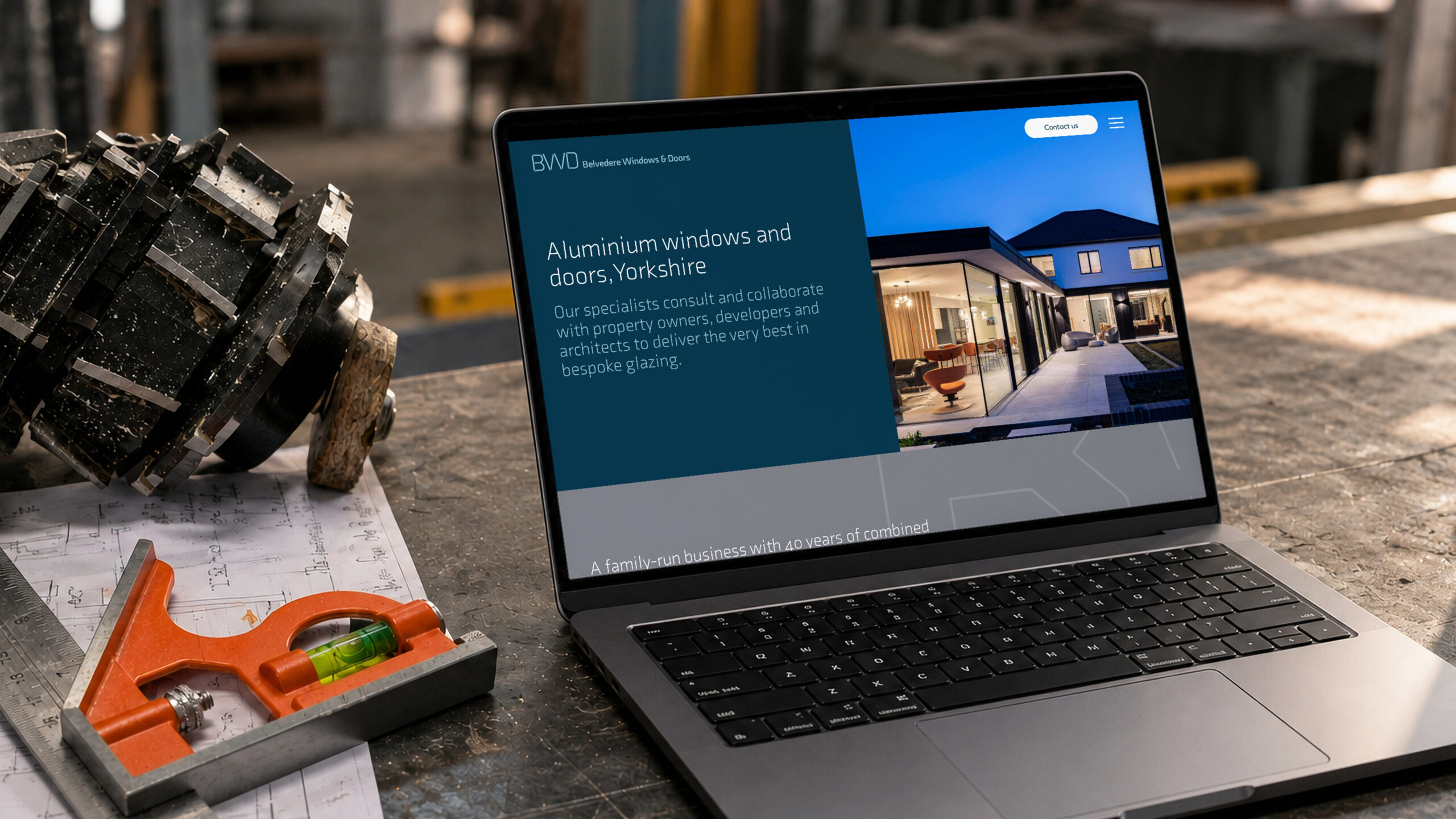 The Belvedere homepage on a laptop in the workshop