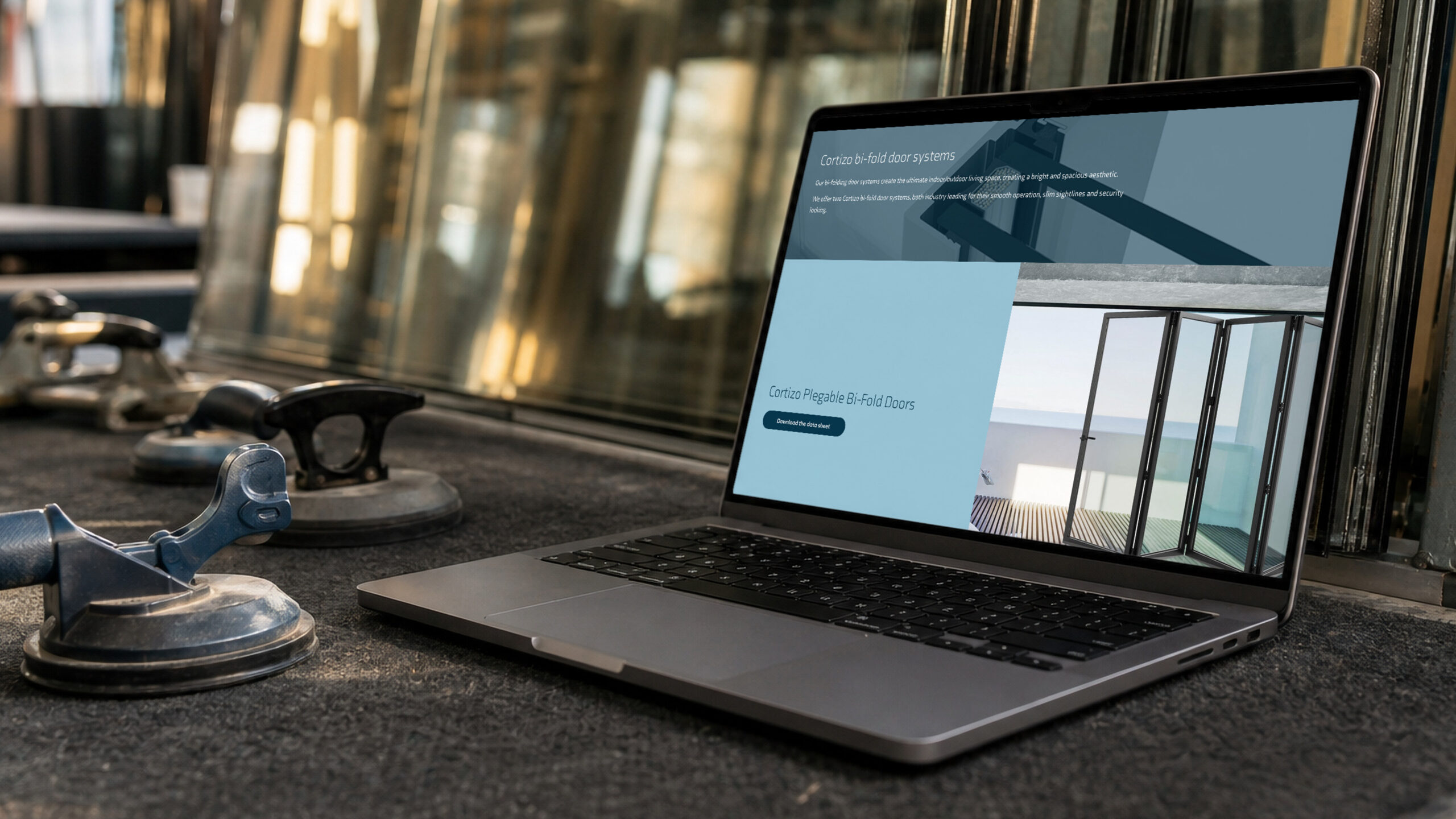 The bi-fold doors page on a laptop at the glazing table