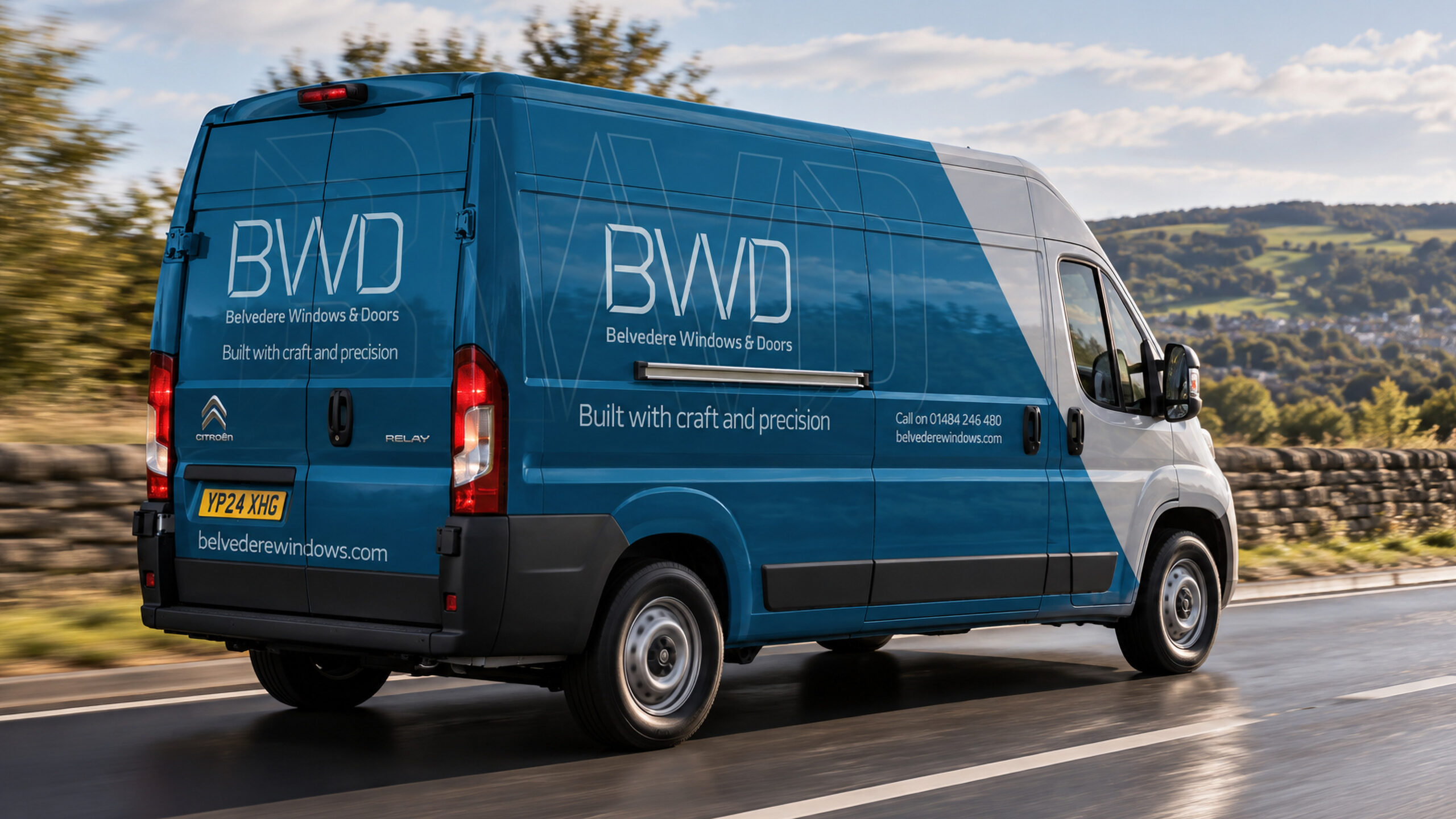 The Belvedere van livery on the road