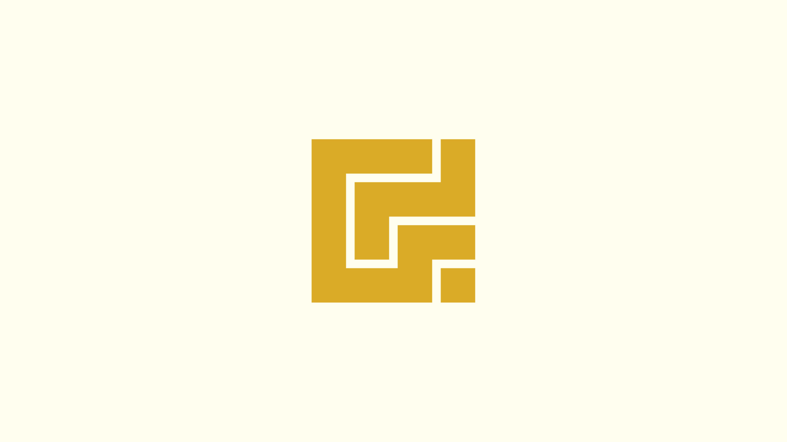 The Gladman G in gold on warm white
