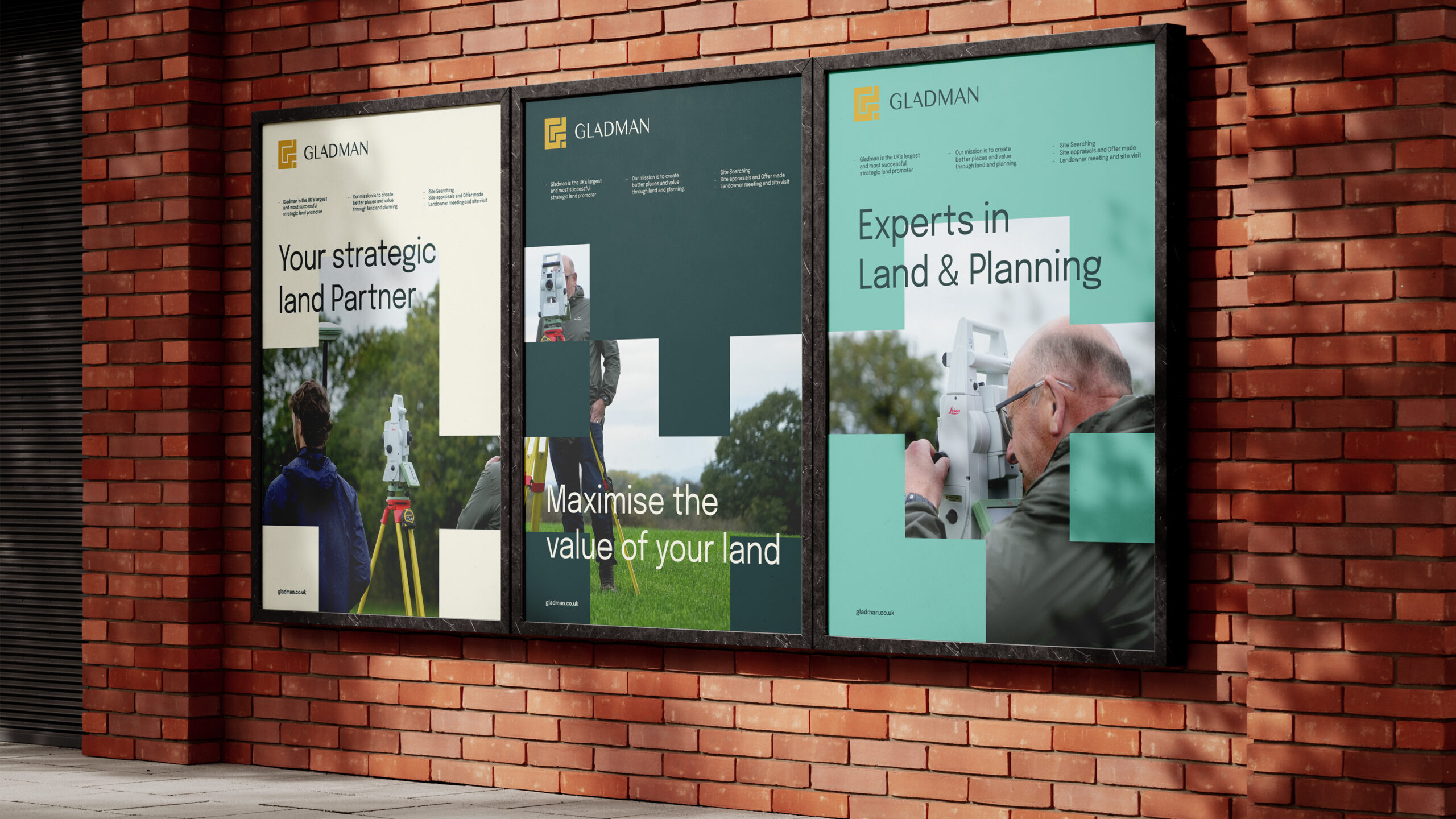 Three Gladman posters on a brick wall